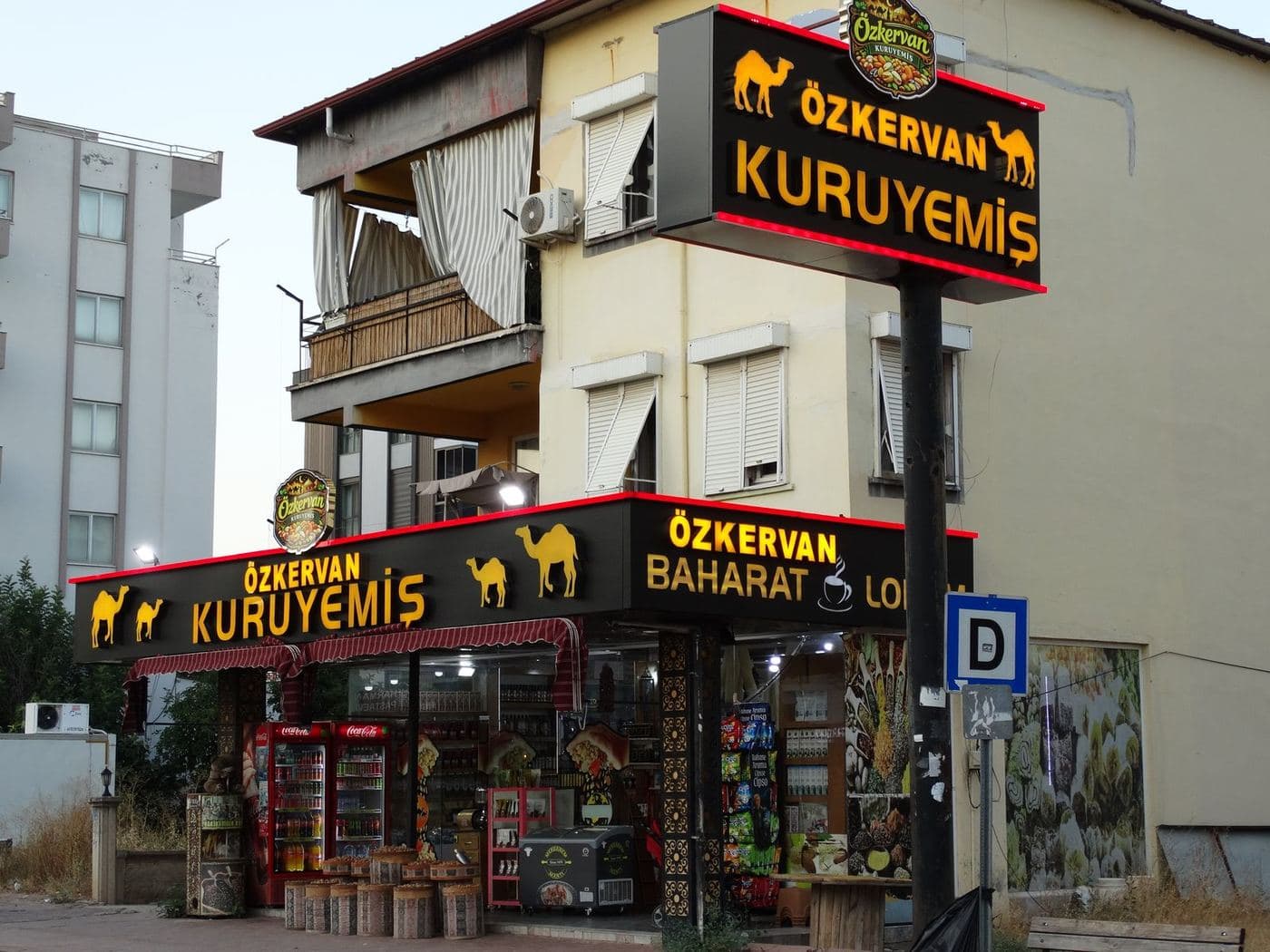 The Döşemealtı branch facade, lit up in the evening